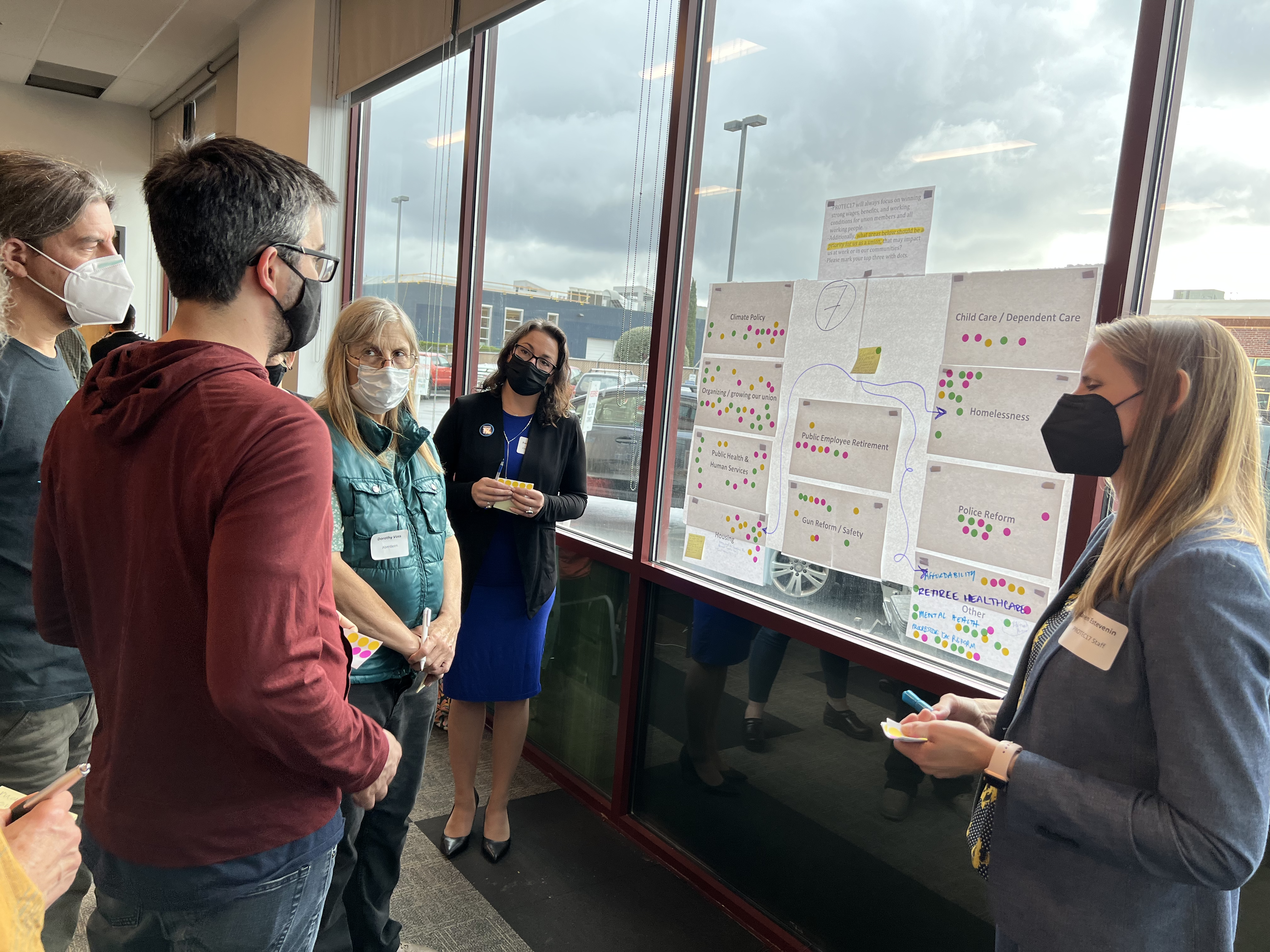 REC Delegates Nick CastroLang (Spokane Health), Paul Cone (Portland) and Dorothy Voss (WSDOT) give their input on priorities for the 2023-25 strategic plan, as PROTEC17 President Rachael Brooks (Seattle) and Executive Director Karen Estevenin look on.