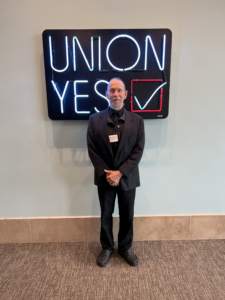 Gold Card recipient Jake Jacobovitch poses for a picture at the REC meeting at the SeattleLabor Temple.